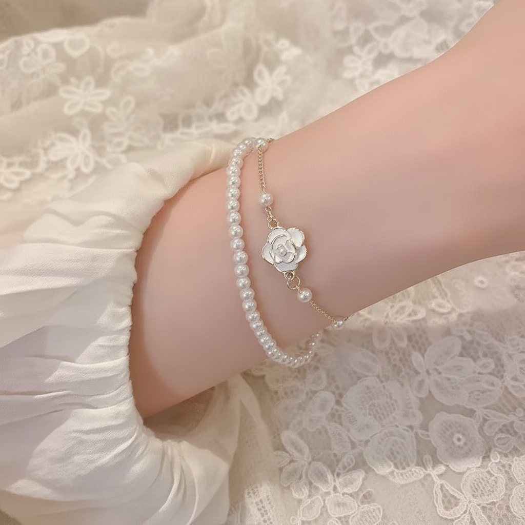 Camellia pearl bracelet worn on wrist